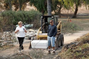 Mom and neighbor Mike with his tractor and cooler full of drinks. 