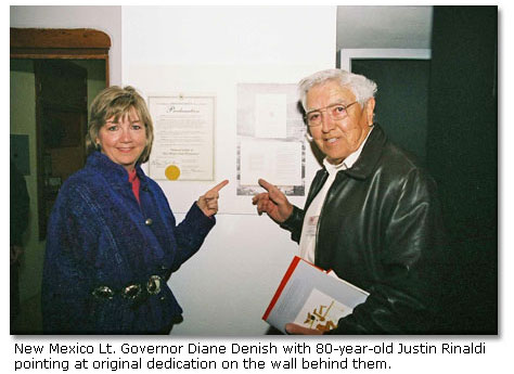 New Mexico Lt. Governor Diane Denish with 80-year-old Justin Rinaldi pointing at original dedication on the wall behind them.