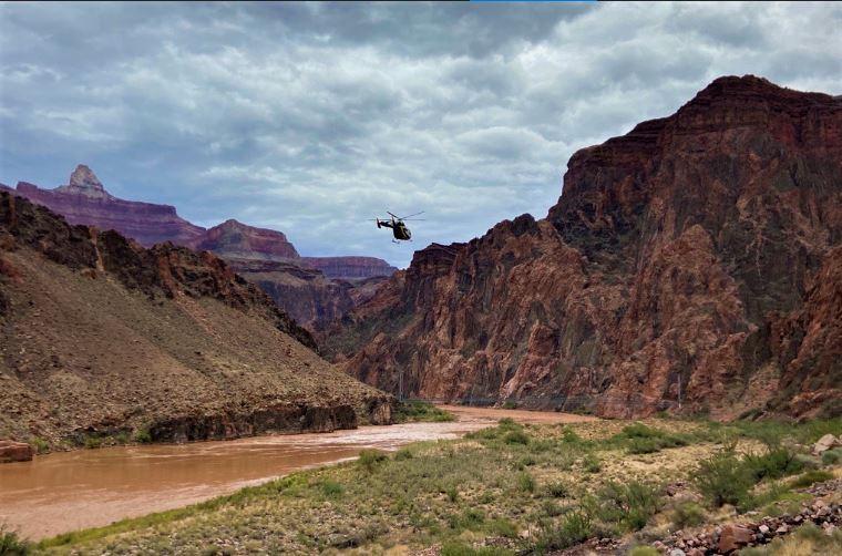 A park helicopter flies into Phantom Ranch along the Bright Angel Trail NPS Photo/D. Yurcik