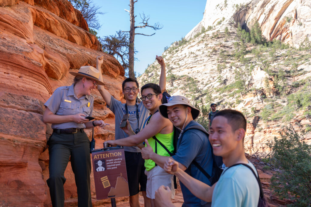 A park ranger checks permits at Scout Lookout. NPS / Ally O'Rullian