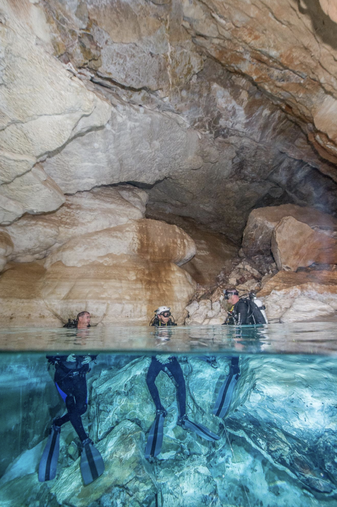 Divers inside Browns Room, one of the rooms in Devils Hole. Photo by Brett Seymour, NPS Submerged Resources Center.