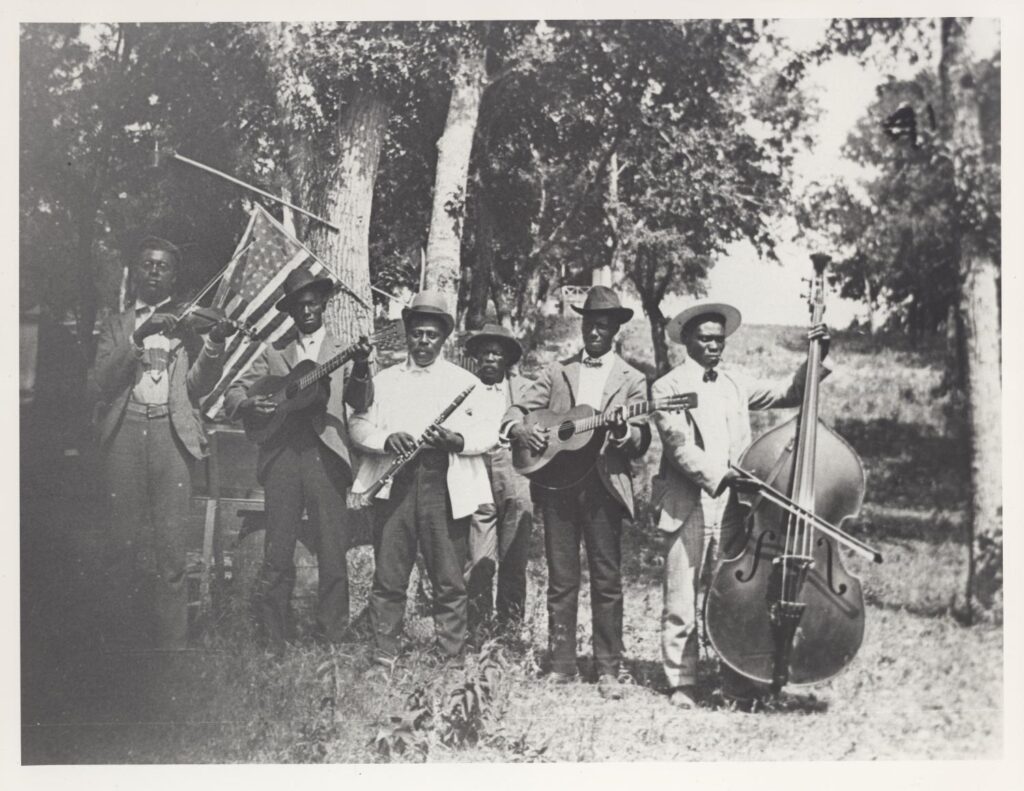 Photograph of African-American band at Emancipation Day celebration, June 19, 1900, held in "East Woods" on East 24th Street in Austin.
Austin History Center, Austin Public Library