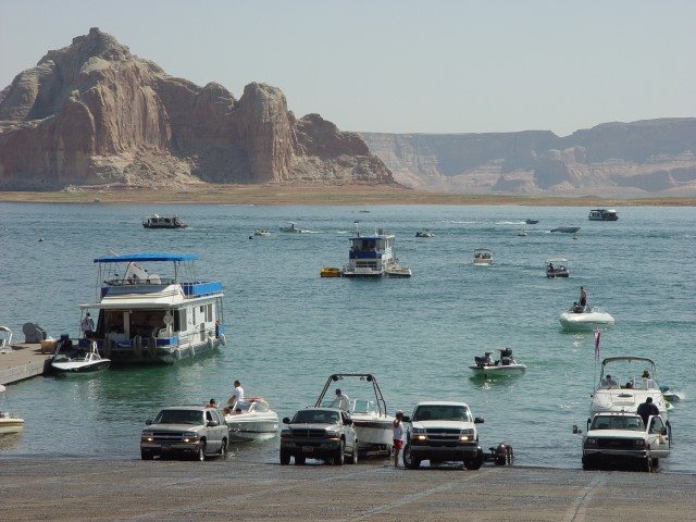 View from Wahweap boat ramp showing a busy day with boats of all sizes launching and operating on Lake Powell Busy day at Wahweap Launch Ramp NPS