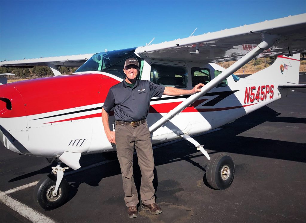Howell in front of a fixed wing aircraft Williams-Grand Canyon News