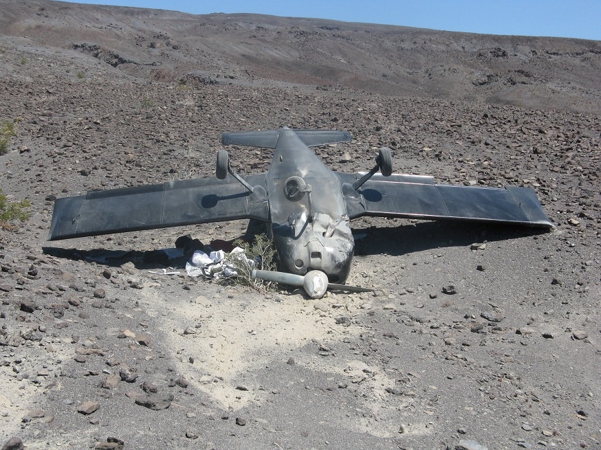 A small plane flipped over forward onto its roof while attempting to land at the challenging "Chicken Strip" in the remote Saline Valley region of Death Valley National Park. NPS Photo.