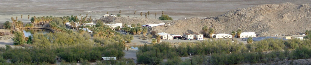Photo of the Zzyzx, showing Lake Tuendae (left) and the Desert Studies Center.