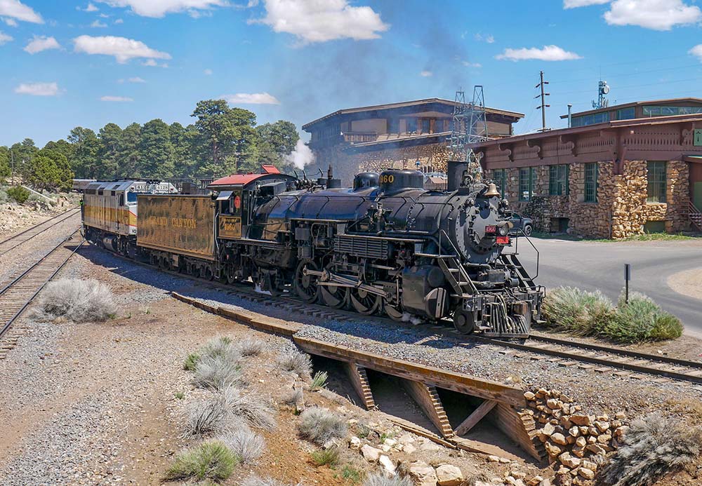 A steam train passes over the wooden ballast bridge above Bright Angel Wash. NPS Photo/M. Quinn