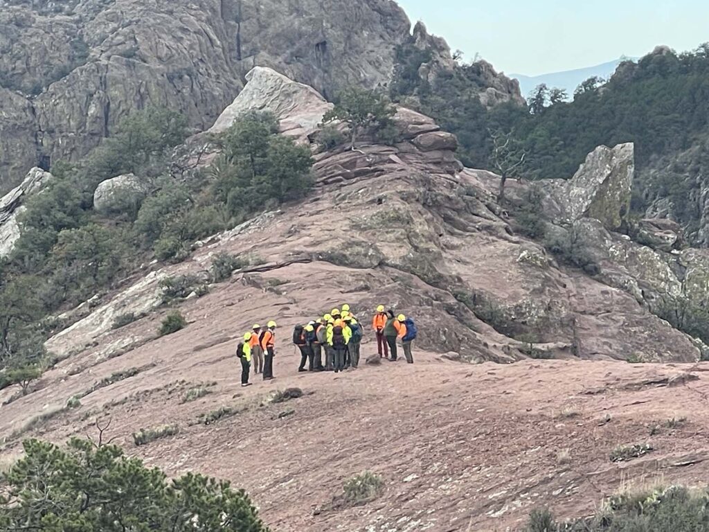 Rescuers transporting Perry near the summit of the Lost Mine Trail TX Department of Public Safety